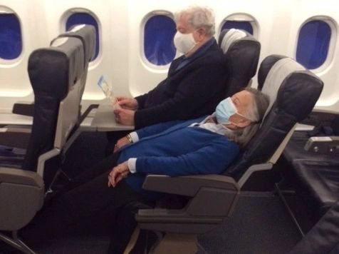 Installed LSEAT seats in an economy cabin row with two passengers seated.