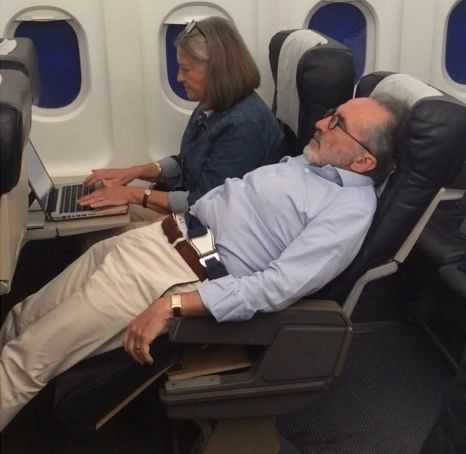 LSEAT economy seats in the relax position with passengers seated upright.